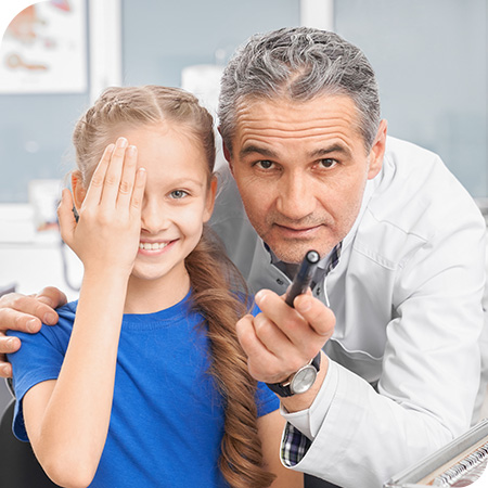 Ophthalmology Associates, S.C. - Eye doctor examining a child patient